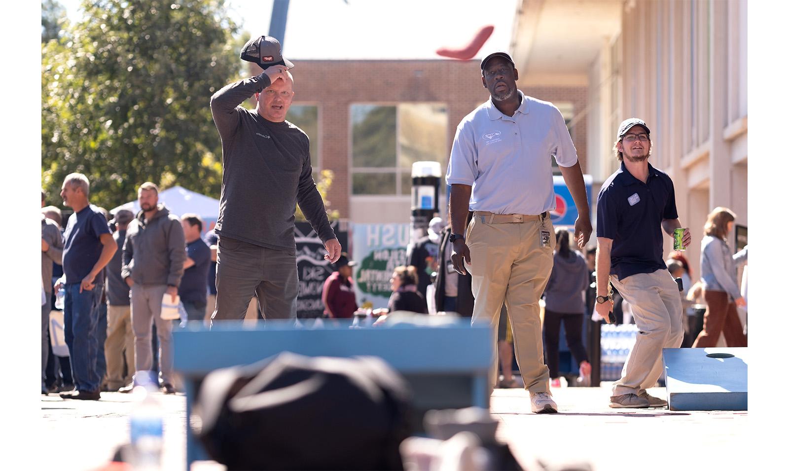 Carolina employees playing cornhole in the Pit