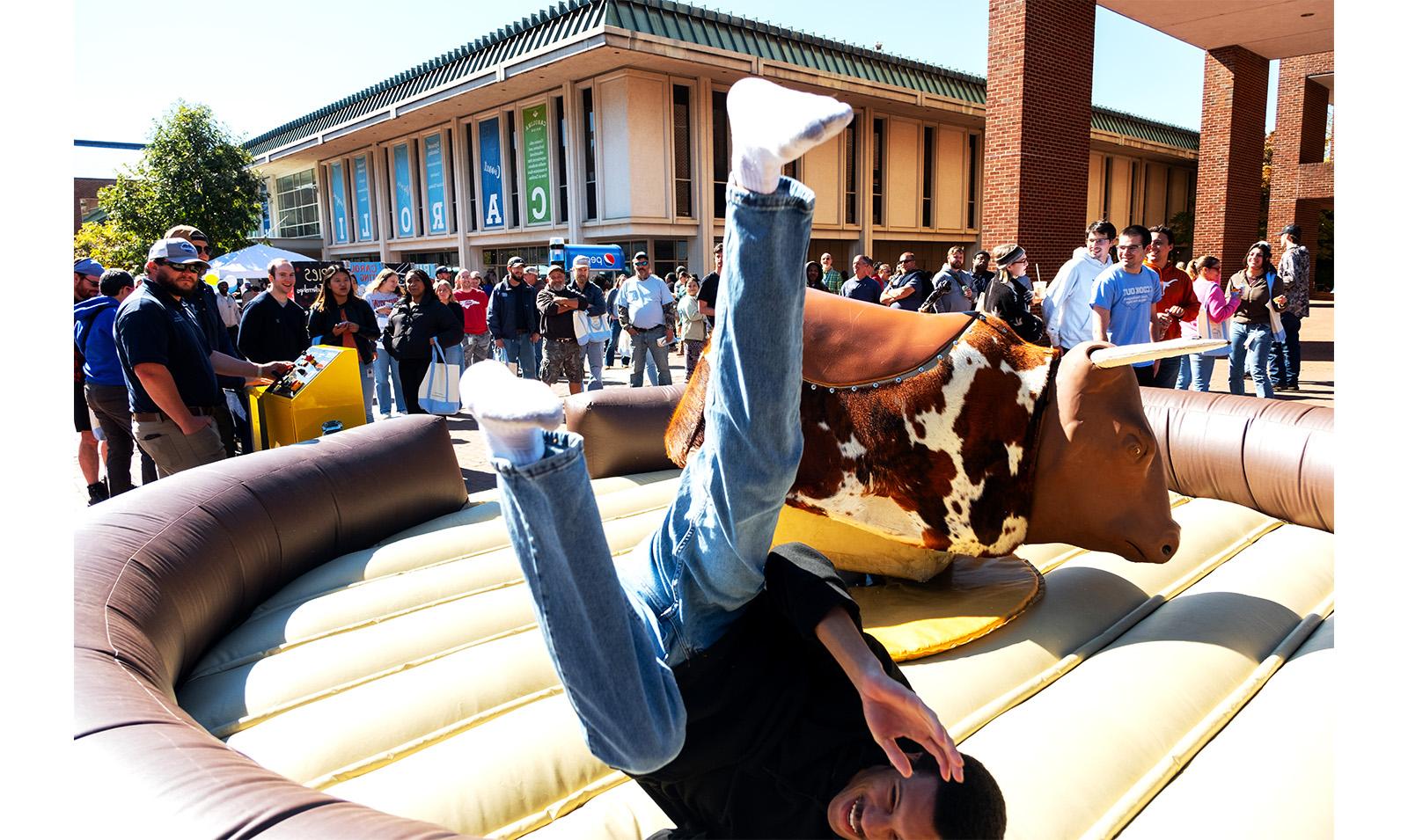 Carolina employee falls off mechanical bull in the Pit during Employee Appreciation Dau