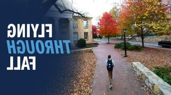 Drone-captured image of a Carolina community member, Brennan Doherty, walking through fall foliage on the campus of UNC-Chapel Hill.